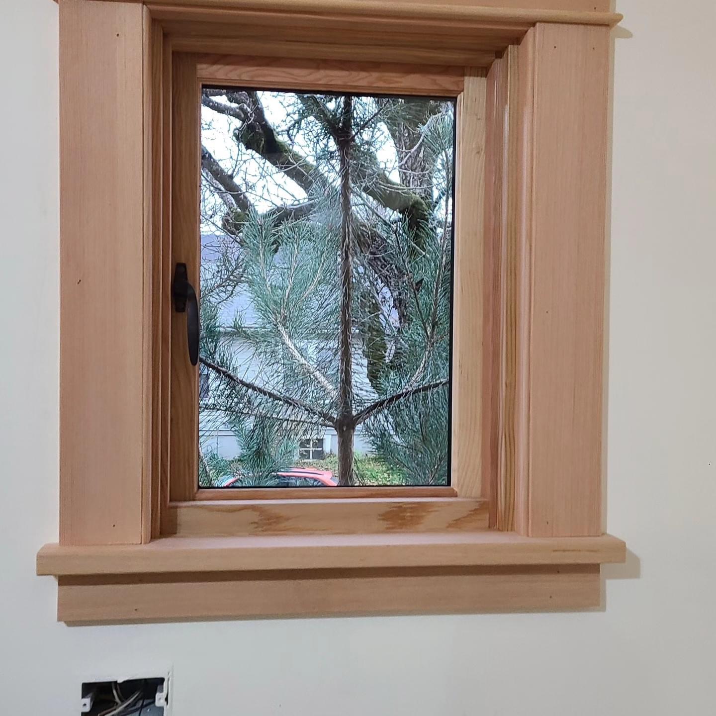 Before — raw unfinished window trim